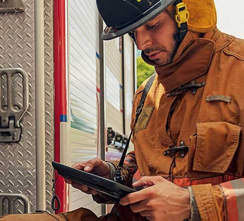 Firefighter using rugged tablet